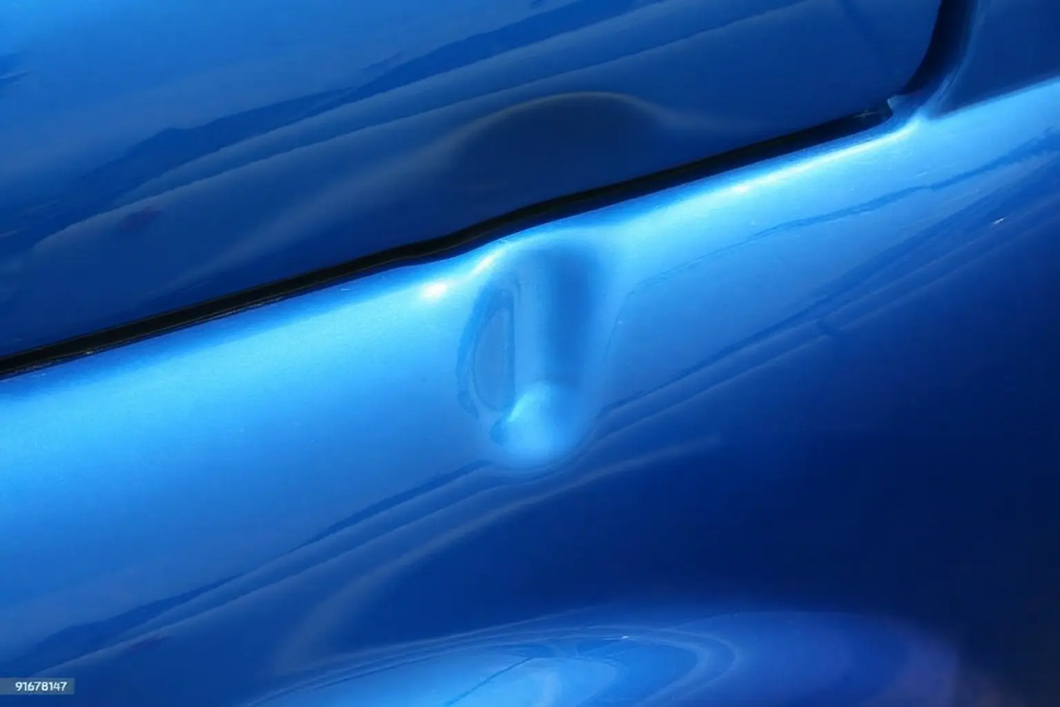 Vehicle dent before cosmetic repair